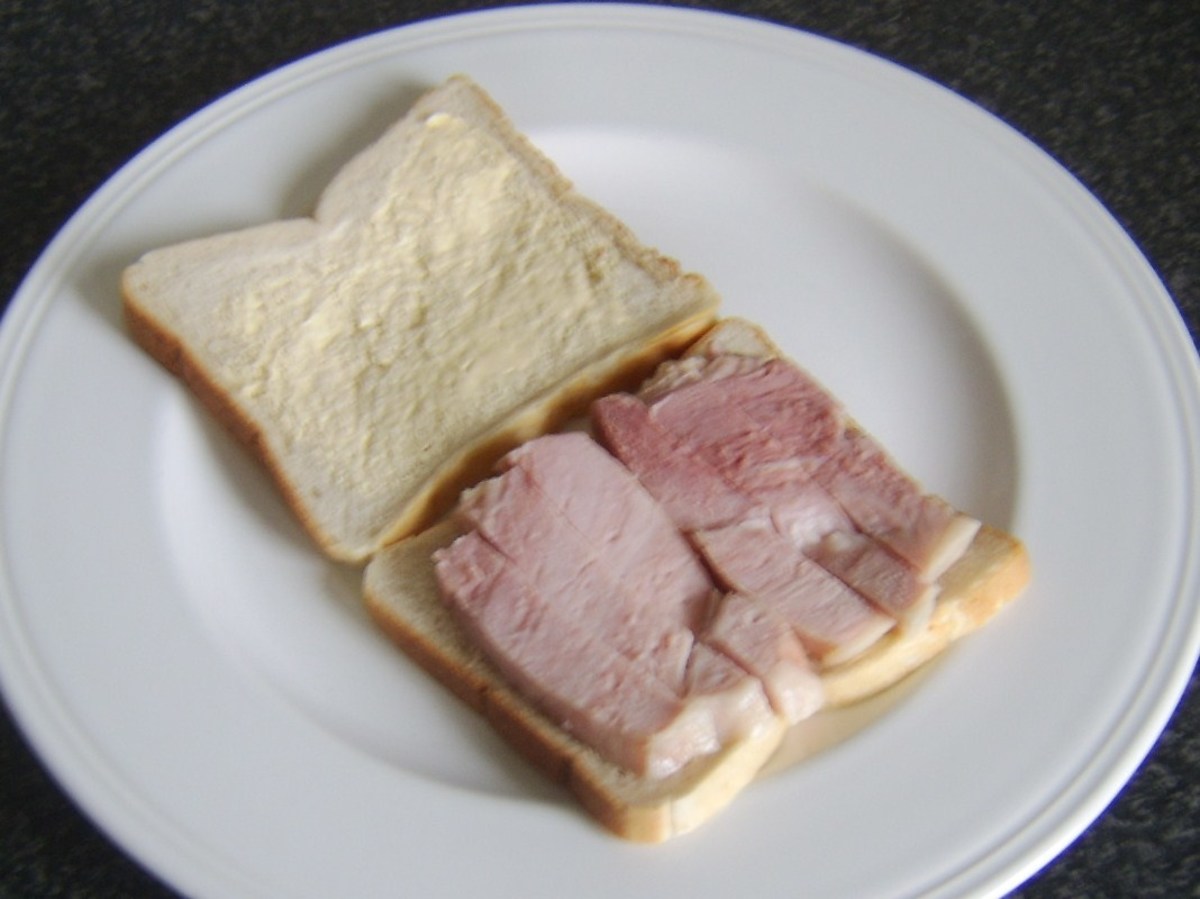 Ham slices are laid on buttered bread
