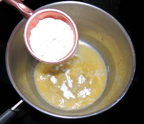add flour to melted butter; cook roux until a bread-ee aroma emanates--about 2-3 minutes