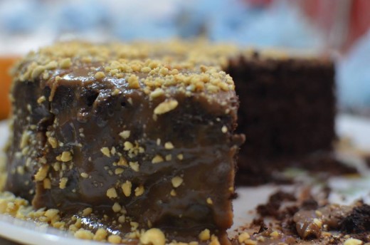 moist chocolate cake with molten snickers frosting taken by Mariam hussain