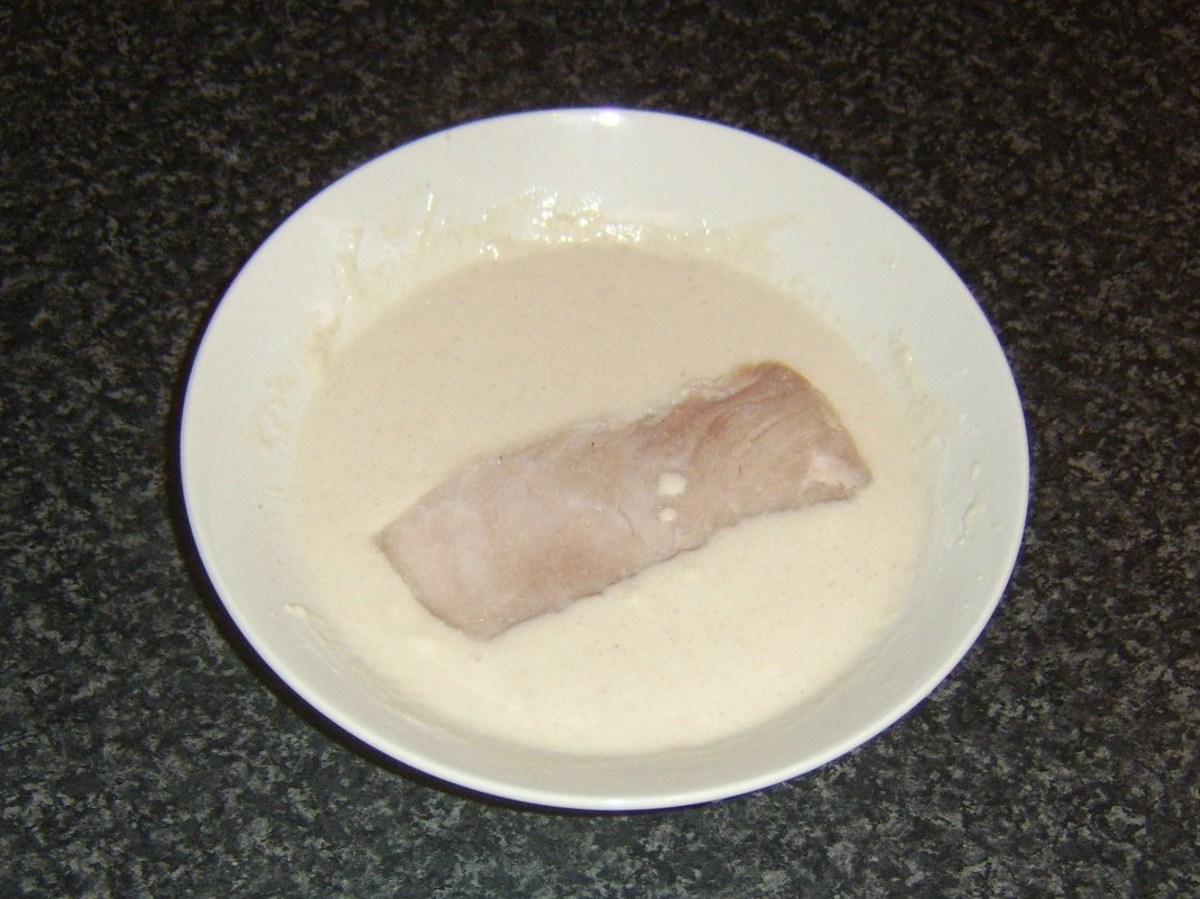 Slices of ham are dipped in batter