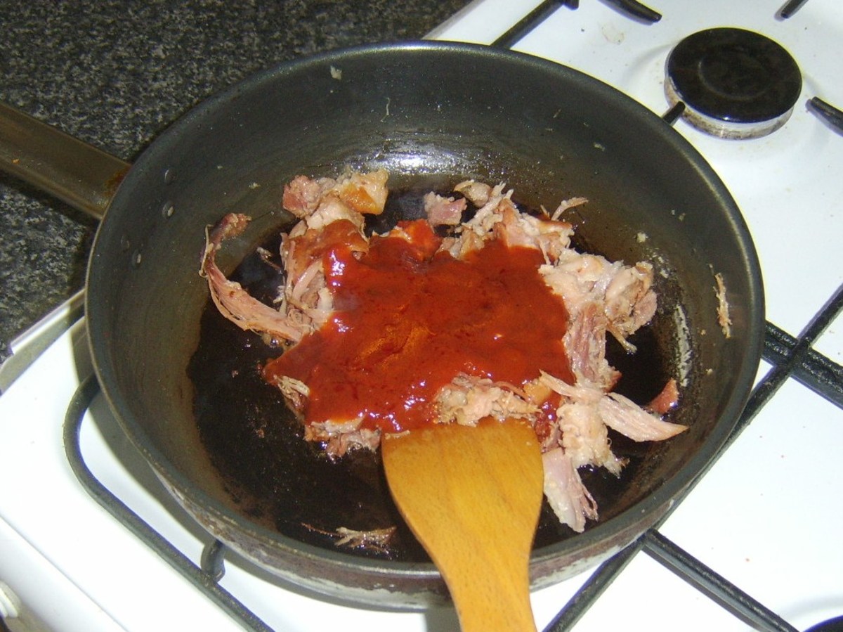 Spicy szechuan tomato sauce is added to stir fried shredded ham