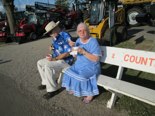 The Henry County Fair in Ohio is a popular event in the summertime for senior citizens. This couple enjoys homemade raspberry ice cream as they sit a spell.