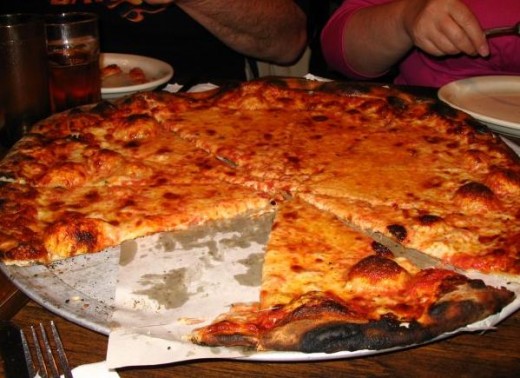 Begin drooling now.  Mmmmmmm.  This pie is from Modern Apizza in New Haven, Connecticut USA.  Thanks to Bruce Marshall for the yummy photo. Hey! where did that first slice go already? 