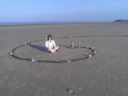 My wife and I are fans of temporary art and sacred geometry. I made this fibonaci spiral with towered stones and seaweed on Rhossili beach :)