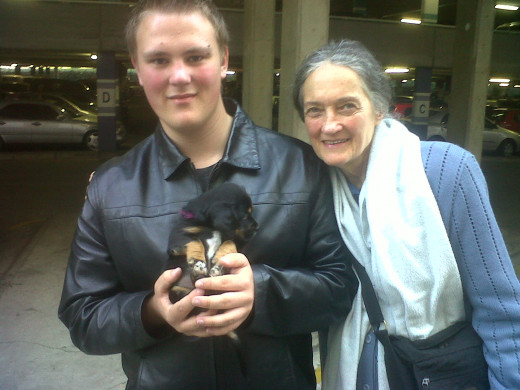My son Danyil-Jon at a time when he was suffering from depression, with his legendary "black jacket". Here he is with his grandmother and puppy.