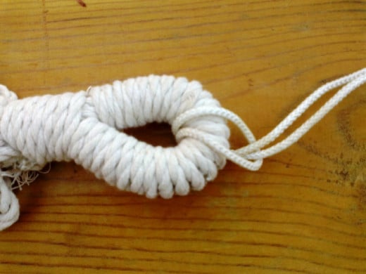 Attach the hammock to the clothesline rope with a simple slip knot.