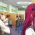 Rika Suzuki (left) and Emi (right) working in their cubicles at the call center. Rika Suzuki (left) and Emi (right) working in their cubicles at the call center.