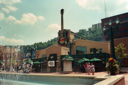 Standing outside the Hard Rock Cafe the day after the concert. That's Carla, me, and Vickie comparing purchases. It's about 95 degrees.