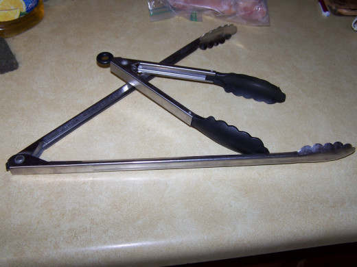 I have two styles of tongs that I use to remove the toasted cheese sticks from the hot oil.