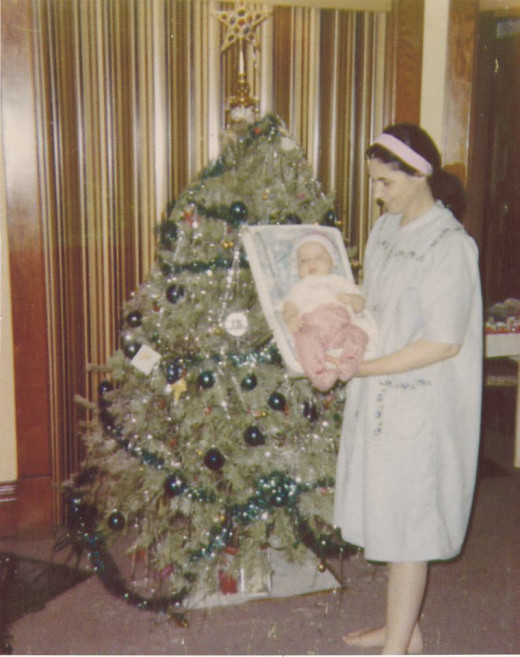 My mother Mary with me as a baby on my first Christmas.