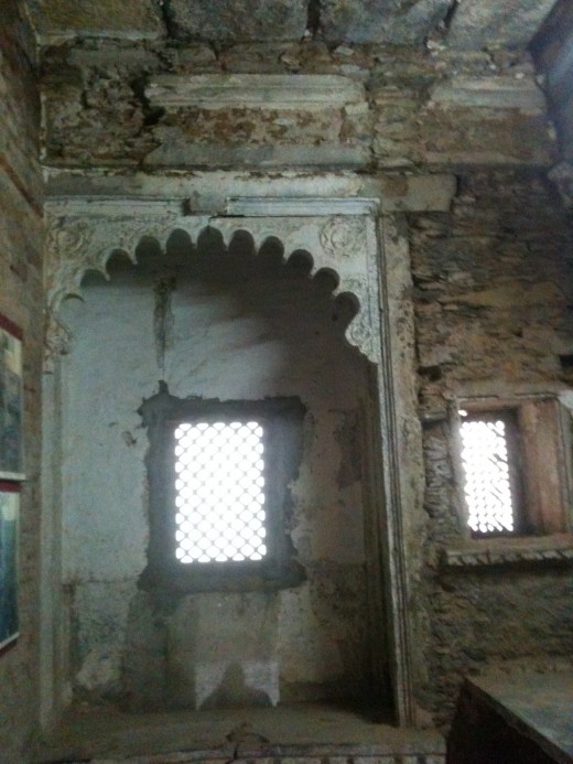 Intricately carved balcony with a window called 'jharokha'.