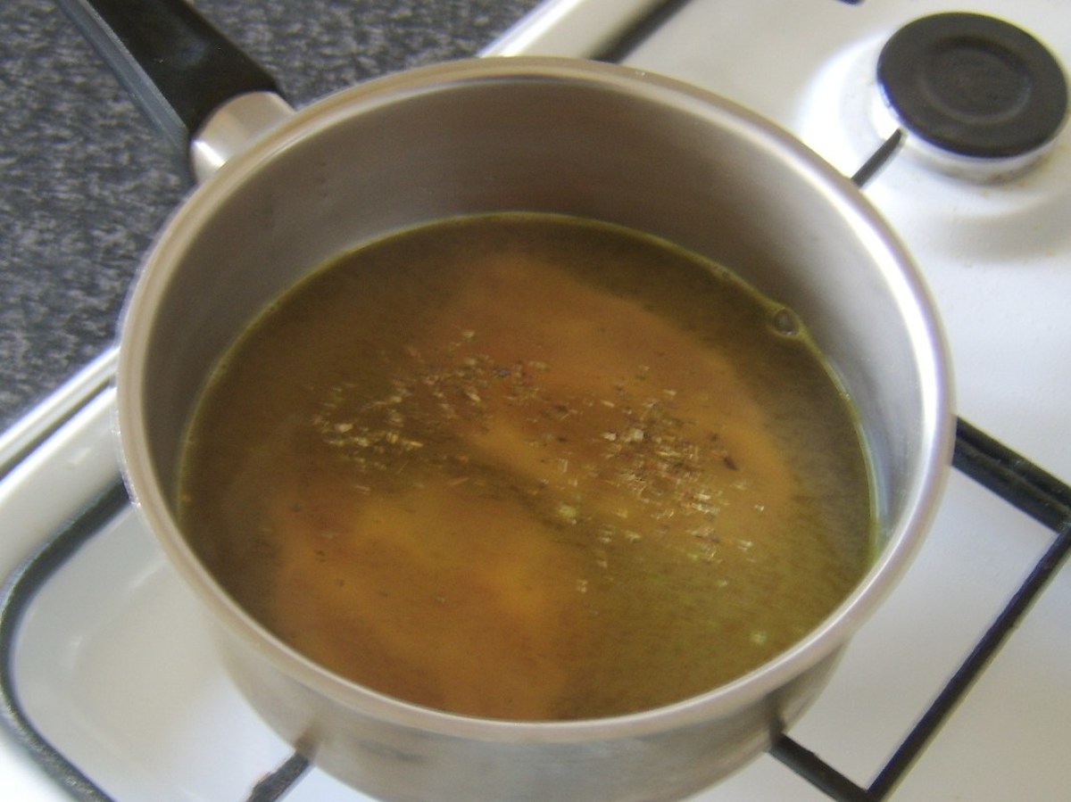 Chicken stock and sage are added to pork shoulder