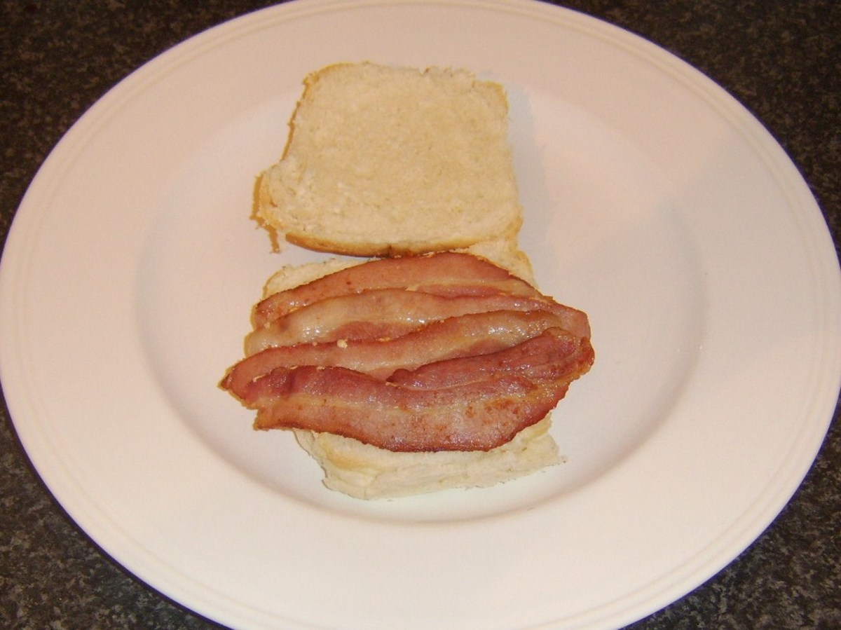 Bacon is laid on bottom of bread roll