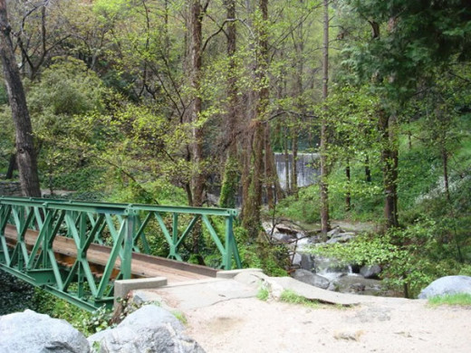 This green bridge is a pleasant surprise to see as you get to the bottom where the paved road ends and is a popular spot to take memorable pictures.