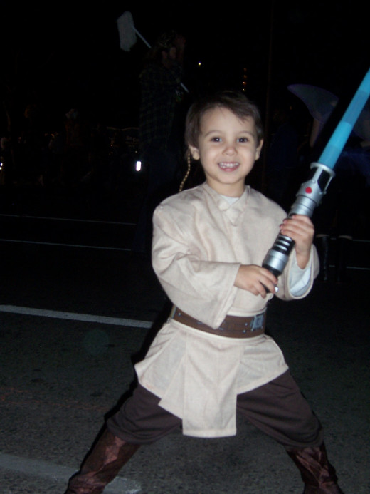 Ari posing in his Jedi Knight costume on Halloween.