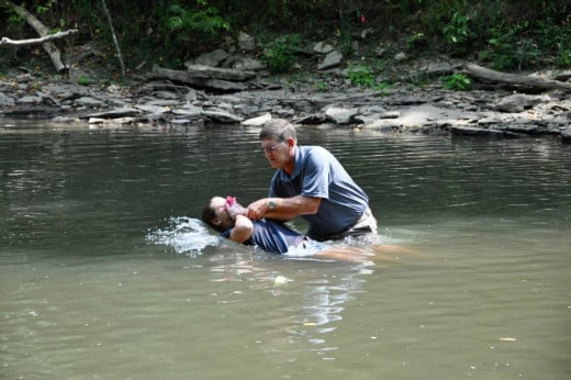 Baptizing my daughter in the river