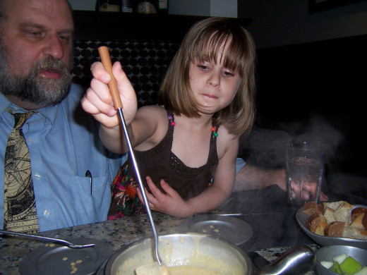 Our daughter enjoying her first fondue experience at 4 1/2 yrs old