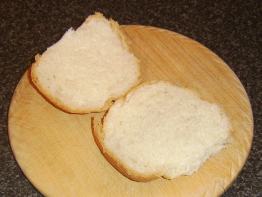 Bread roll is sliced in half