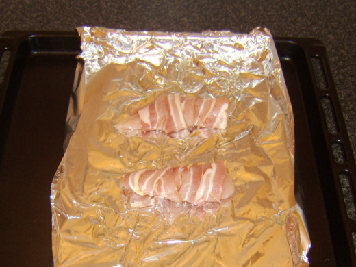 Chicken breast and bacon ready to be grilled/broiled