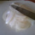 Slice each half as thinly as possible. Slice each half as thinly as possible.