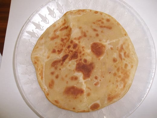 A fresh well done chapati. Two of these orbs make a very fulfilling lunch, with a drink of course.