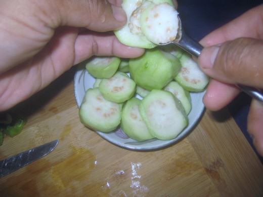 Core the guavas. (From preliminary medical research in laboratory models, extracts from apple guava leaves or bark are implicated in therapeutic mechanisms against cancer, bacterial infections, inflammation and pain.)