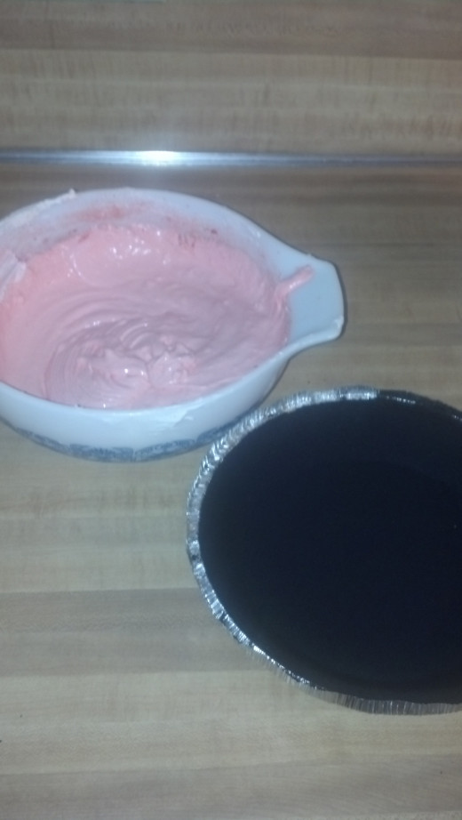 Mix cream cheese, whipped cream and raspberry gelatin to make the basic pie filling. The crust can easily be purchased ready made from the store.