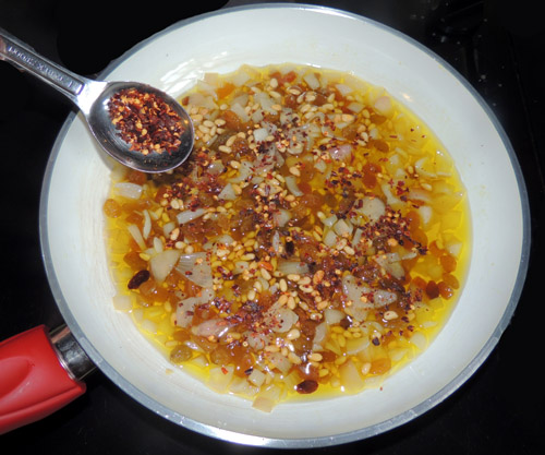 Add chili flakes. Let this cook for 5 minutes.