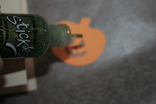 Apply glitter to the stem to turn it green.  