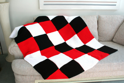 Warm and cozy checkered knitted afghan