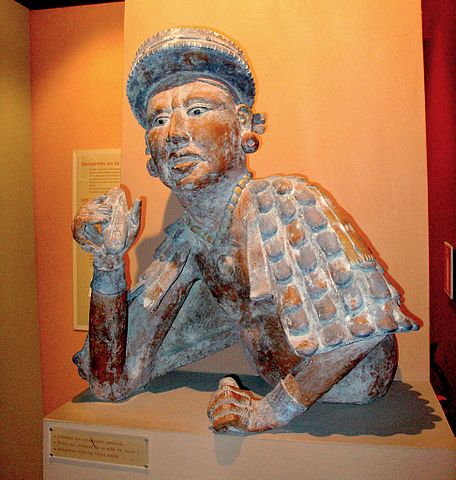 Sculpture of a Mayan nobleman holding cocoa paste