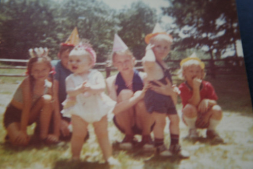 I was the birthday girl.  The baby in white.