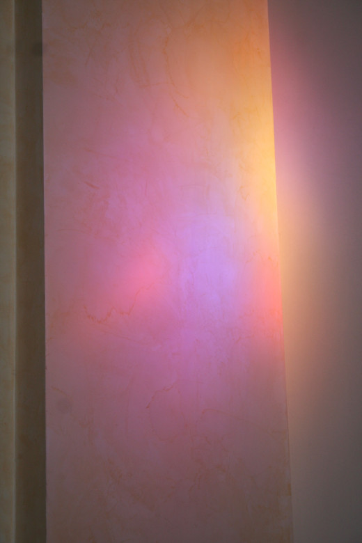 Rainbow light reflected on a church wall