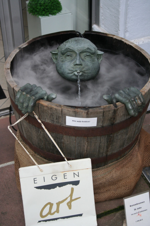 Clever fountain outside shop in Heidelberg, Germany