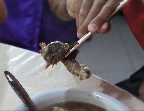 Bad Food - chicken head found in bowl of soup in crap restaurant near Terra Cotta Army site.