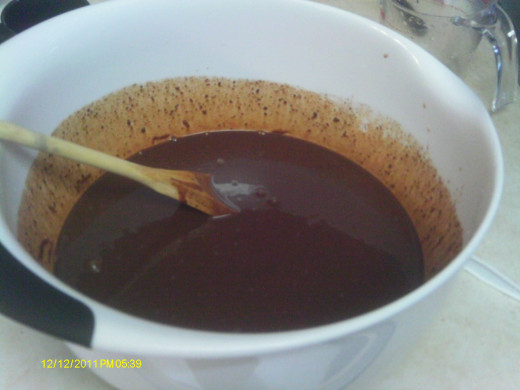 Stir heated cream over chocolate until smooth and creamy.