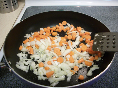 Heat the olive oil and add the garlic, onion, and carrots.