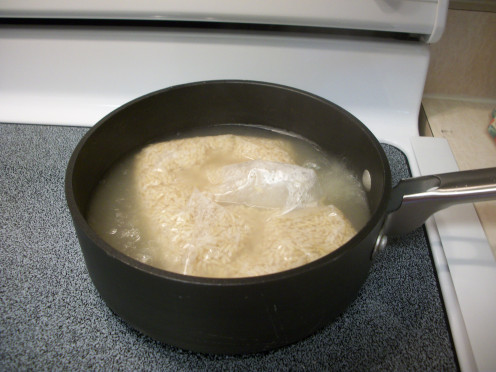 Take 2 bags of Boil-in-a-Bag Rice and follow cooking instructions. White or brown rice can be used.