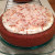 Place plenty of toasted coconut over the first frosted cake layer. Place plenty of toasted coconut over the first frosted cake layer.