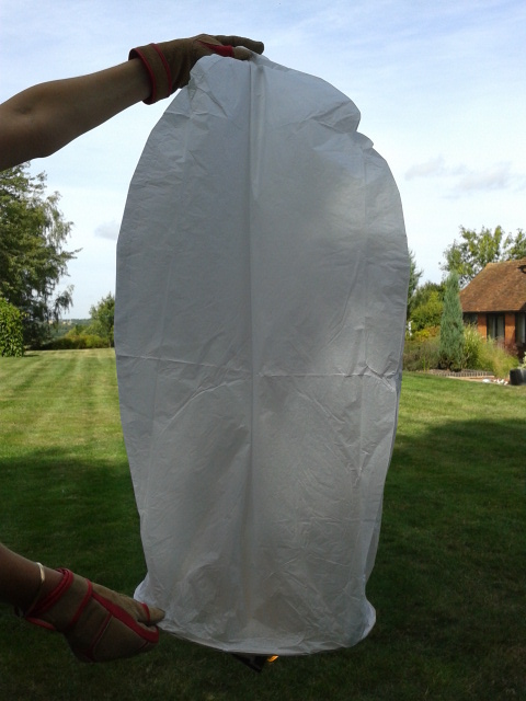 Flip the lantern and gently hold the top and bottom