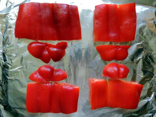 slice, seed, flatten red bell peppers, and place on foil