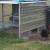 This small chicken house holds our larger hens at night. The structure is mainly metal and wire - with a wooden side facing the direction of winds and bad weather. Some of the smaller hens also choose to stay in this particular chicken house. This small chicken house holds our larger hens at night. The structure is mainly metal and wire - with a wooden side facing the direction of winds and bad weather. Some of the smaller hens also choose to stay in this particular chicken house.