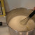 The mixture starts out thin and with heat, starts to thicken after about 15 minutes depending on your stove. The mixture starts out thin and with heat, starts to thicken after about 15 minutes depending on your stove.