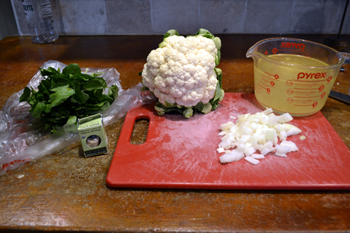 The ingredients... from left to right: watercress, white pepper, cauliflower, onion, and stock (either chicken of veggie if making vegan)