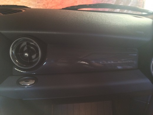 The passenger side of a vehicle.  Glove box below, but nothing else seems to stick out.