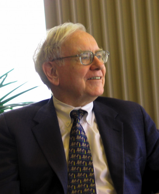 Warren Buffet is smiling. Yet, he claims he doesn't make any business decision with emotions like happiness!