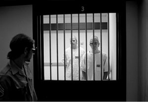 Image of guard and prisoners in Zimbardo's study at Stanford.