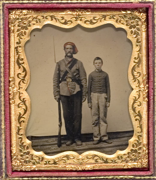 Militiaman and drummer boy for a Massachusetts unit. Note the gray uniform - blue was not the standard color for all Union forces when war broke out.