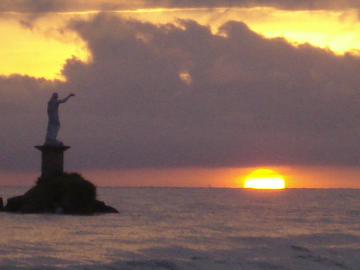 On my 45th birthday I got to witness the Sunrise over the Caribbean Sea for the first time in my life.  Taken in Livingston, Guatemala.  This is the "Statue of Liberty," Garifuna people style!