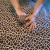Here we are tufting the buttons through the top of the fabric and into the foam. Here we are tufting the buttons through the top of the fabric and into the foam.